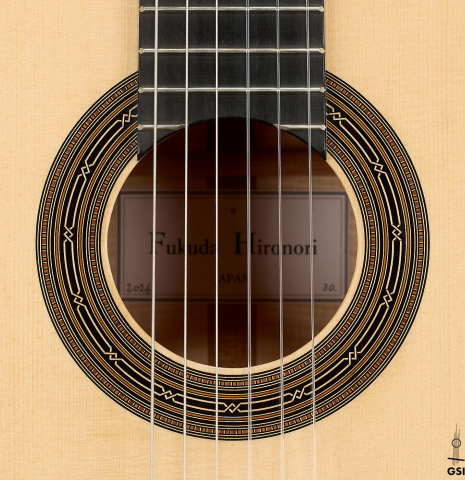 The rosette of a 2026 Hironori Fukuda classical guitar made of spruce and maple