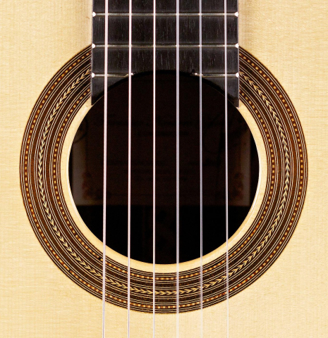 The rosette of a 2014 Francisco Navarro Garcia &quot;Hauser&quot; classical guitar made with spruce and cocobolo