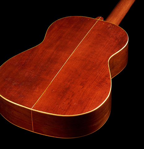 The back and sides at the foot of a 1903 Enrique Garcia classical guitar made of spruce and mahogany