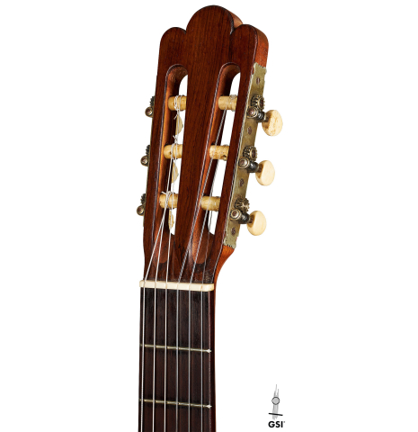 The headstock of a 1903 Enrique Garcia classical guitar made of spruce and mahogany