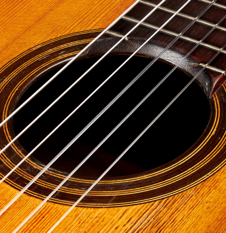 Closeup of the rosette of a 1903 Enrique Garcia classical guitar made of spruce and mahogany
