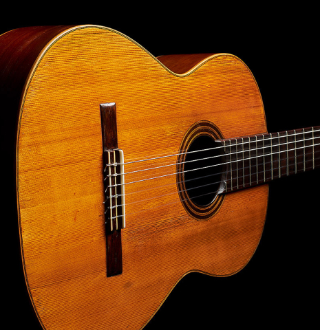 The soundboard of a 1903 Enrique Garcia classical guitar made of spruce and mahogany