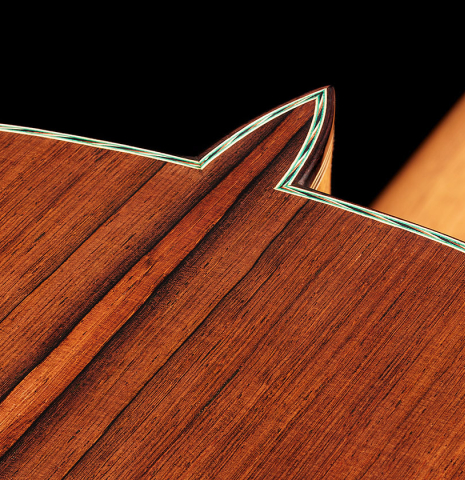 The heel, back binding and purflings of a 2024 Dario Garcia classical guitar made of cedar and African rosewood