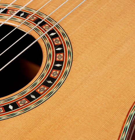 Close-up detail of the top and rosette of a 2024 Dario Garcia classical guitar made of cedar and African rosewood