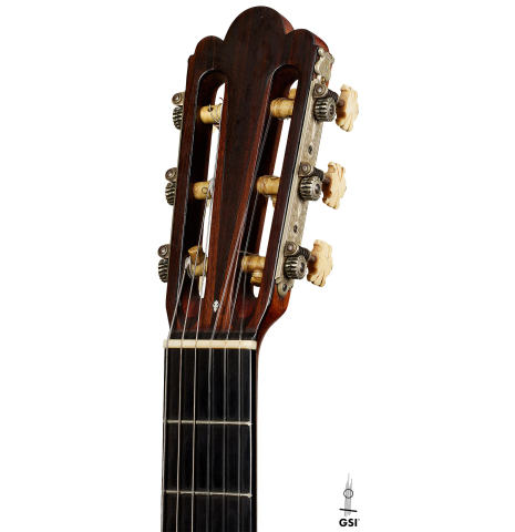 The headstock of a 1918 Enrique Garcia classical guitar made of spruce and CSA rosewood