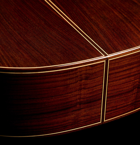 The back and sides at the foot of a 2024 Francisco Navarro Garcia "Rodriguez" classical guitar made of cedar and Indian rosewood