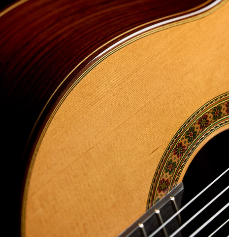 The soundboard and side of a 2024 Francisco Navarro Garcia "Rodriguez" classical guitar made of cedar and Indian rosewood