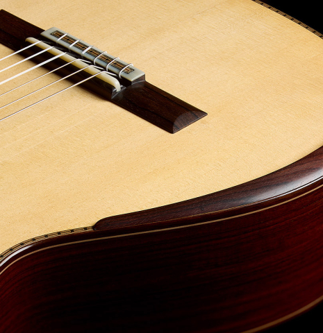 The top and arm rest of a 2023 Francisco Navarro Garcia classical guitar made of spruce and Indian rosewood