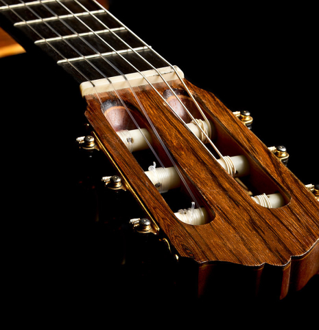 The tuning machines and fingerboard of a 1993 Abel Garcia (supervised by Jose Romanillos) "1912 Manuel Ramirez ex Segovia" classical guitar made of spruce and Indian rosewood
