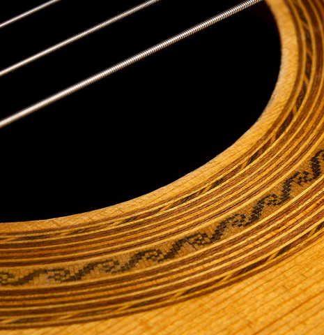 The top and rosette detail of a 1993 Abel Garcia (supervised by Jose Romanillos) "1912 Manuel Ramirez ex Segovia" classical guitar made of spruce and Indian rosewood
