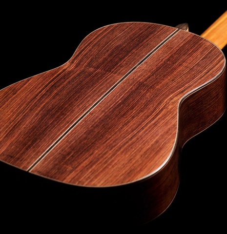 The back of a 2022 Michel Belair &quot;Hommage a Daniel Friederich&quot; classical guitar made of cedar and Indian rosewood