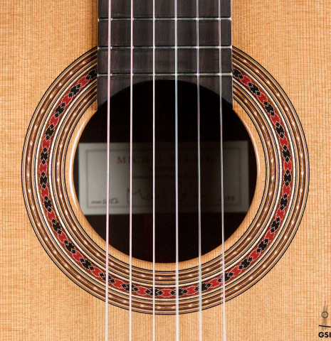 The rosette of a 2022 Michel Belair &quot;Hommage a Daniel Friederich&quot; classical guitar made of cedar and Indian rosewood