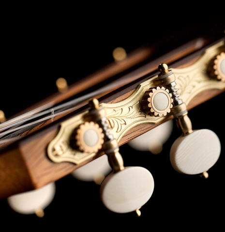 The machine heads of a 2021 Pavel Gavryushov classical guitar made of cedar and African rosewood