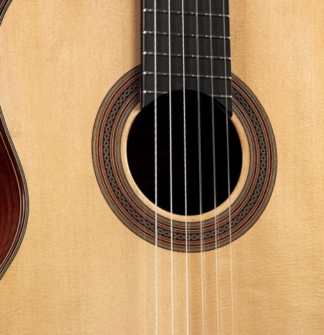 The soundboard and rosette of a 2023 Pavel Gavryushov classical guitar made of spruce and Indian rosewood