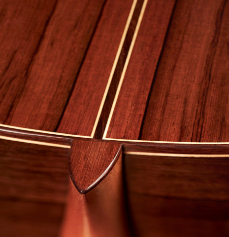 The heel, neck joint, back and sides and back purflings of a 2023 Pavel Gavryushov classical guitar made of spruce and African rosewood