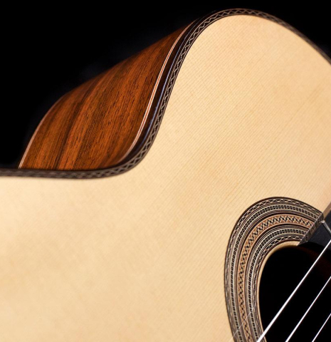 The soundboard and side of a 2017 Ennio Giovanetti classical guitar made with spruce top and CSA rosewood back and sides
