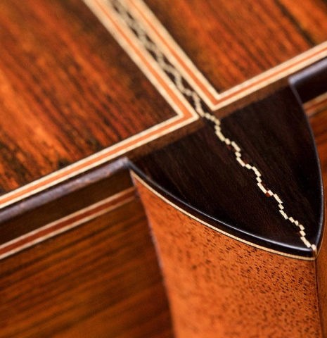 The close-up of a heel of a 2017 Ennio Giovanetti classical guitar made with spruce top and CSA rosewood back and sides