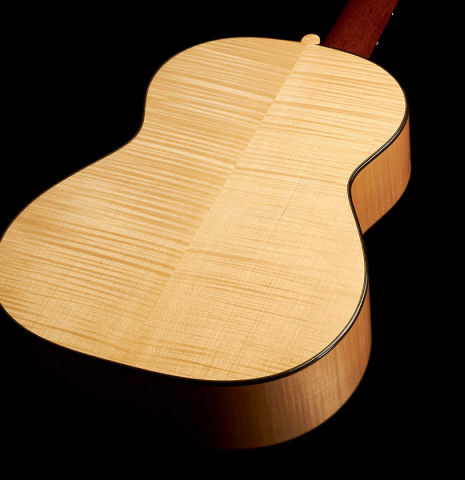The back of a 1991 Gioachino Giussani classical guitar made of spruce and maple.