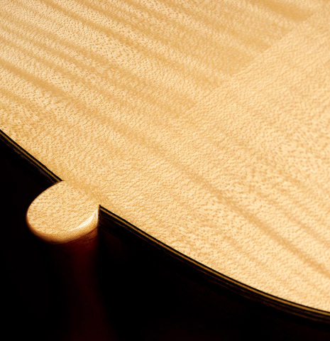 The back and heel of a 1991 Gioachino Giussani classical guitar made of spruce and maple.