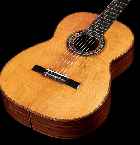 The front of a 1900's Casa Gonzalez classical guitar made of spruce and CSA rosewood