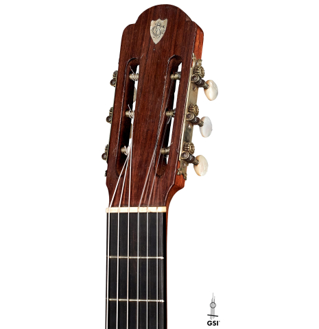 The headstock of a 1900's Casa Gonzalez classical guitar made of spruce and CSA rosewood