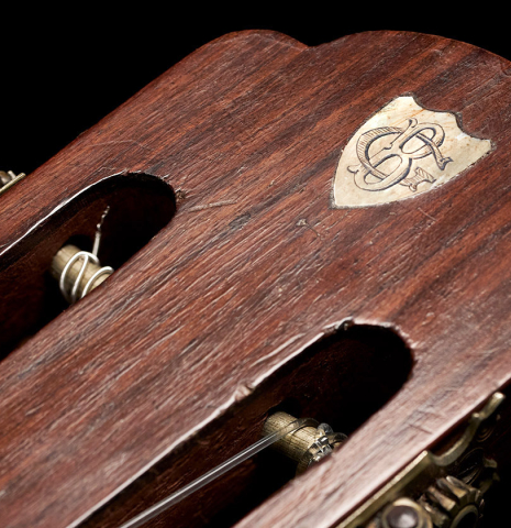 The headstock of a 1900's Casa Gonzalez classical guitar made of spruce and CSA rosewood
