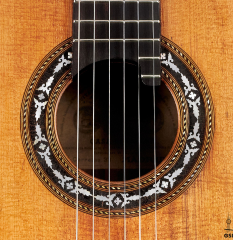 The rosette of a 1900's Casa Gonzalez classical guitar made of spruce and CSA rosewood