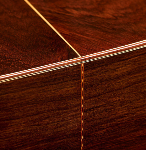 The back and sides at the foot of a 2025 Mario Grimaldi "1920 Santos" classical guitar made of spruce and African rosewood