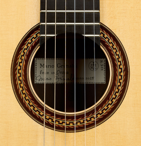 The rosette of a 2025 Mario Grimaldi "1920 Santos" classical guitar made of spruce and African rosewood