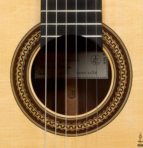 The rosette of a 2026 Mario Grimaldi "1920 Santos" classical guitar made of spruce and African rosewood