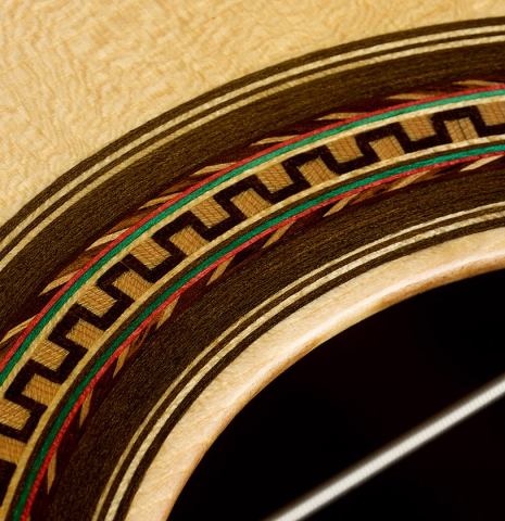 The top and rosette detail of a 2026 Mario Grimaldi "1920 Santos" classical guitar made of spruce and African rosewood