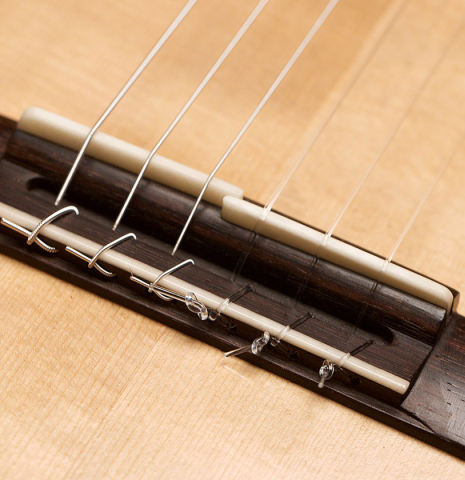 The bridge and broken saddle of a 2019 Mario Gropp "Weissgerber" made of spruce and exotic ebony