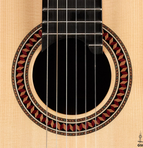The rosette of a 2021 Yulong Guo &quot;Chamber Concert&quot; classical guitar made with spruce top and Indian rosewood back and sides.