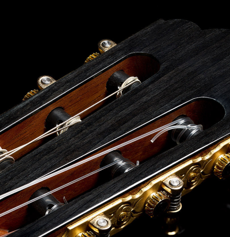 The three-lobed headstock of a 2025 Yulong Guo "Torres SE 124" classical guitar made of spruce and Indian rosewood