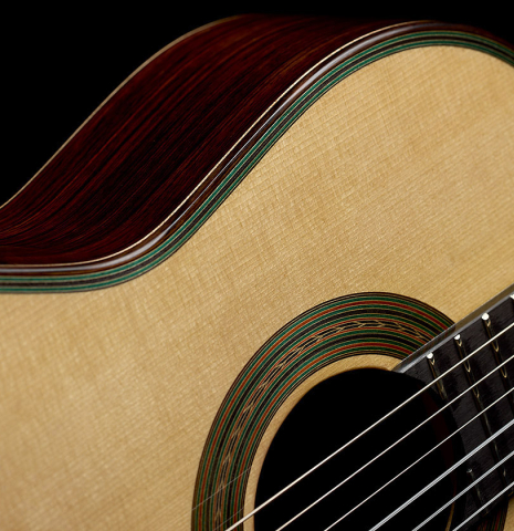 The soundboard and rosette of a 2025 Yulong Guo "Torres SE 124" classical guitar made of spruce and Indian rosewood