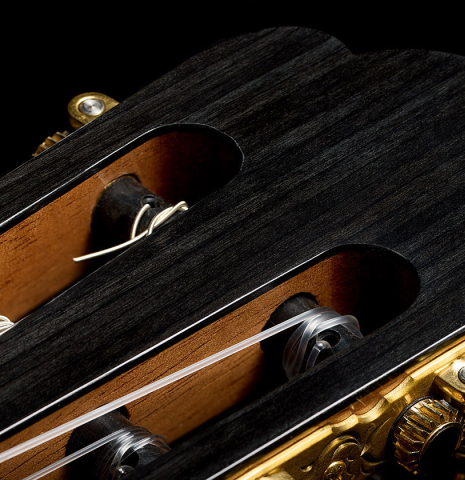 The three-lobed headstock shape of a 2025 Yulong Guo "Torres SE 124" classical guitar made of spruce and cypress