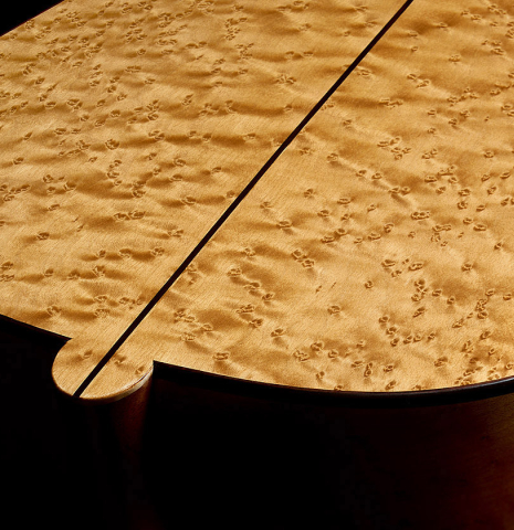 The top and sides of a 2025 Yulong Guo "Torres SE 124" classical guitar made of spruce and maple