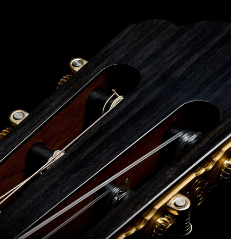 The three-lobed headstock shape of a 2025 Yulong Guo "Torres SE 124" classical guitar made of spruce and maple