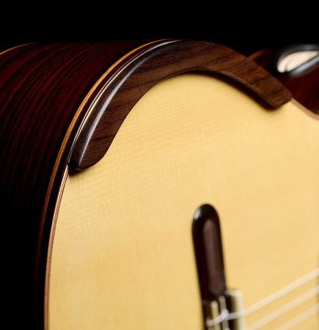 The armrest and soundboard of a 2018 Yulong Guo "Chamber Concert" classical guitar made of spruce and Indian rosewood