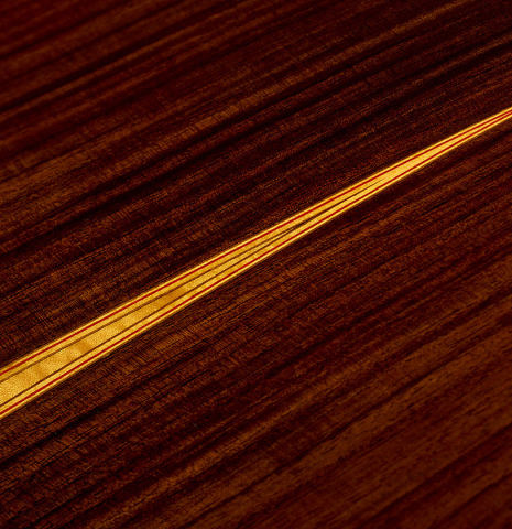 The back center seam of a 2018 Yulong Guo "Chamber Concert" classical guitar made of spruce and Indian rosewood