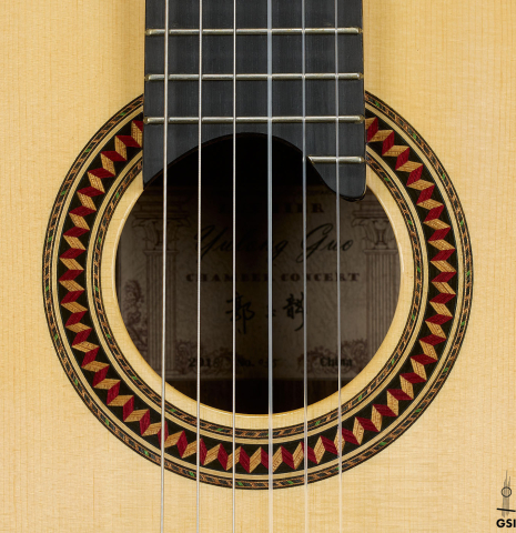 The rosette of a 2018 Yulong Guo "Chamber Concert" classical guitar made of spruce and Indian rosewood