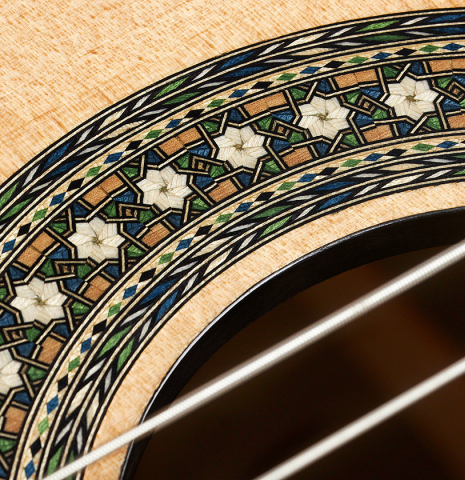 Detail of the rosette of a 2023 Miguel Angel Gutierrez classical guitar made of spruce and Indian rosewood.