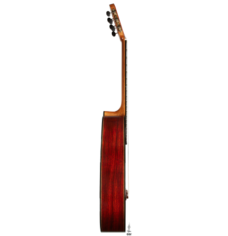 The side of a 2025 Miguel Angel Gutierrez "REG 2025" classical guitar made of cedar and padauk