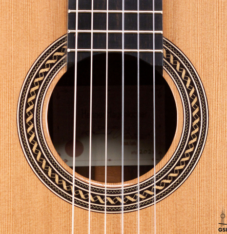 The rosette of a 2021 Henner Hagenlocher classical guitar made with cedar and CSA rosewood