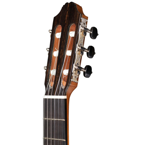 The headstock and machine heads of a 2015 Henner Hagenlocher made with spruce top and CSA rosewood back and sides