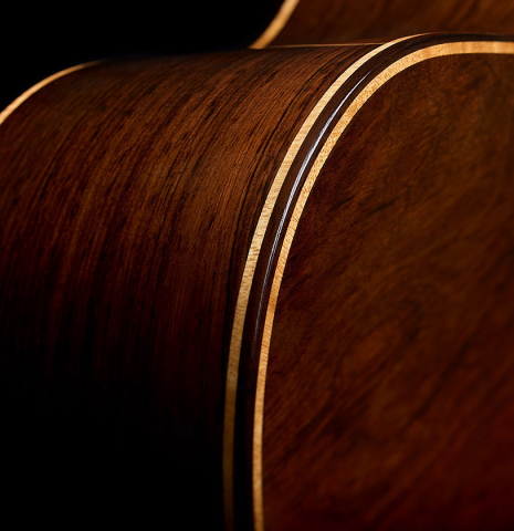 The back and side binding and purfling of a 2026 Henner Hagenlocher classical guitar made of spruce and CSA rosewood