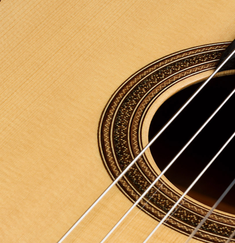 The soundboard and rosette of a 2026 Henner Hagenlocher classical guitar made of spruce and CSA rosewood