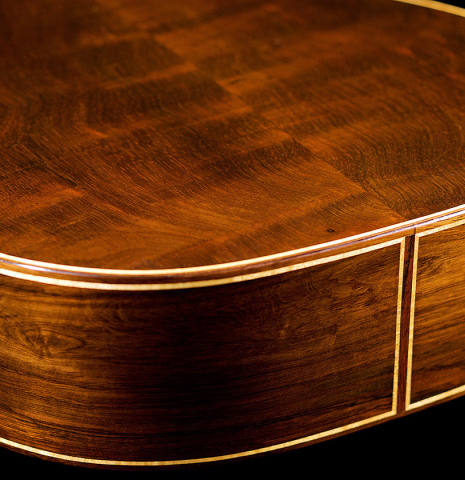 The back and sides of a 2008 Henner Hagenlocher classical guitar made of cedar and CSA rosewood