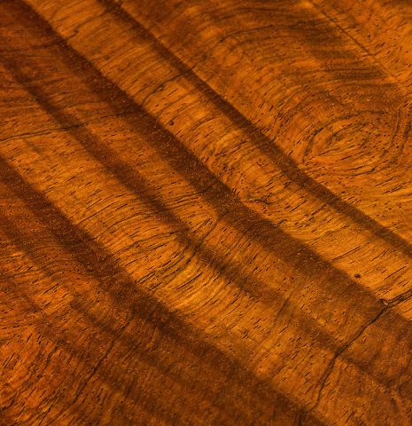 Close-up photo of a the back of a 2008 Henner Hagenlocher classical guitar made of cedar and CSA rosewood