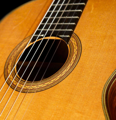 The soundboard of a 1992 Hermann Hauser III classical guitar made with spruce top and CSA rosewood back and sides.